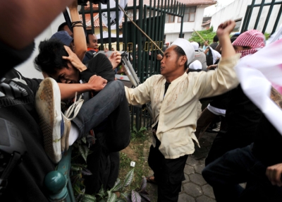 Indonesian Muslim group members clash with supporters of Indonesian rock star Nazril Ariel     outside the court house in West Java on January 31, 2011 after it was announced that he would serve three and a half years in jail over sex tapes. (Bay Ismoyo /AFP/Getty Images)