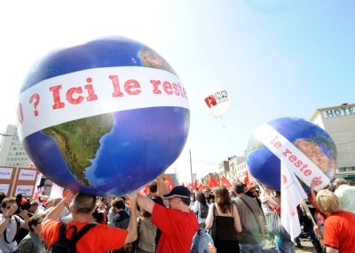 Anti-G8 activists hold globes reading 'Hello G20? This is the rest of the world' as they take part in a demonstration, on May 21, 2011 in Le Havre, northwestern France, to denounce last week's G8 summit in Deauville, France. (Damien Meyer/AFP/Getty Images)