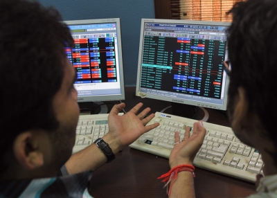 Indian stockbrokers react as they monitor share prices during intraday trade at a brokerage firm in Mumbai on August 5, 2011. Indian shares plunged by nearly four percent to its lowest point in over a year, triggered by US economic worries and the European debt crisis which have spooked world markets. (Indranil Mukherjee/AFP/Getty Images)