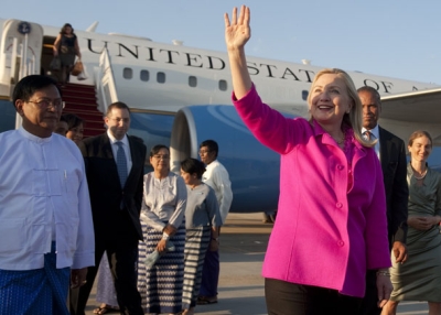 US Secretary of State Hillary Clinton waves alongside Myanmar Deputy Foreign Minister Myo Myint (L) upon her arrival in Naypyidaw on November 30, 2011.(Saul Loeb /AFP/Getty Images)