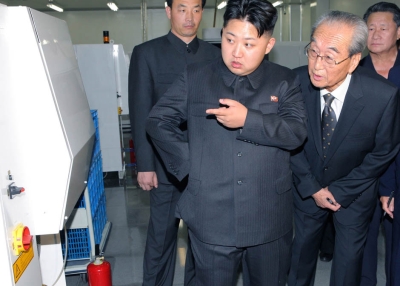 Kim Jong Un (C), dubbed the "Great Successor" to Kim Jong Il (not pictured), visits Mokran Video Company in Pyongyang in this undated picture released by the North's official KCNA news agency on Sept. 11, 2011.