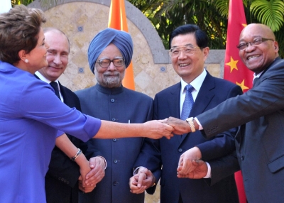(L to R) Brazilian President Dilma Roussef, Russian President Vladimir Putin, Indian Prime Minister Manmohan Singh, Chinese President Hu Jintao and South African President Jacob Zuma join their hands during a BRICS's Presidents meeting in Los Cabos, Baja California, Mexico on June 18, 2012 before the opening of the G20 leaders Summit. (Roberto Stuckert Filho/AFP/Getty Images)