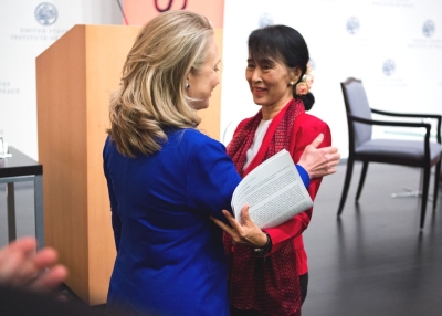 Myanmar parliamentarian Aung San Suu Kyi (R) and U.S. Secretary of State Hillary Clinton embrace during an Asia Society event at the United States Institute of Peace in Washington, D.C., on September 18, 2012. (Asia Society/Joshua Roberts)