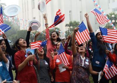 Indian university students celebrate after hearing a prediction that U.S. President Barack Obama was reelected during a U.S. embassy election party at a local hotel in Delhi on November 7, 2012. (Roberto Schmidt/AFP/Getty Images)