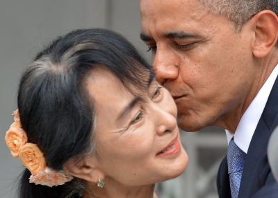 U.S. President Barack Obama kisses Myanmar opposition leader Aung San Suu Kyi after making a speech at her residence in Yangon on November 19, 2012. (Jewel Samad/AFP/Getty Images)