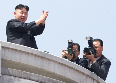 North Korean leader Kim Jong-Un (L) applauds during a military parade in honor of the 100th birthday of the late North Korean leader Kim Il-Sung in Pyongyang on April 15, 2012. (Ed Jones/AFP/Getty Images)
