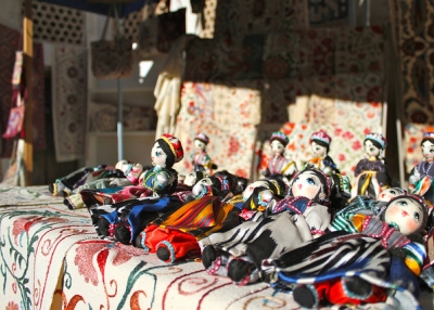 A row of handmade dolls line a market stall in Bukhara, Uzbekistan on October 1, 2012. (erh1103/Flickr)