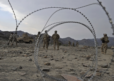 U.S. Army soldiers walk across rocky terrain during a mission in the Turkham Nangarhar region of Afghanistan (bordering Pakistan) on Oct. 5, 2011. (Tauseef Mustafa/AFP/Getty Images)