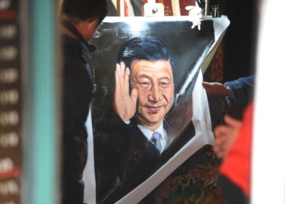 A painting of President Xi Jinping for sale in a Shanghai shop. (Peter Parks/AFP/Getty Images)