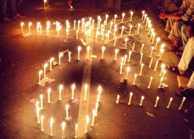 Protestors in the Shahbag area in Dhaka, Bangladesh arrange lit candles to form the number 71 in Bangla, signifying the 1971 Bangladesh Liberation War. (Naorose Bin Ali)