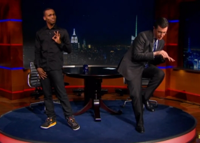 Charles "Lil Buck" Riley (L) teaches Stephen Colbert how to jook Thursday, February 21, 2013, in New York.