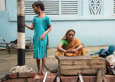 A mother and child anxiously wait for business in Dhaka, Bangladesh on June 26, 2013. (Sudipta Arka Das/Flickr)