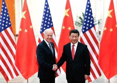 Chinese President Xi Jinping (R) shakes hands with U.S. Vice President Joe Biden (L) inside the Great Hall of the People in Beijing on December 4, 2013. (Lintao Zhang/AFP/Getty Images)