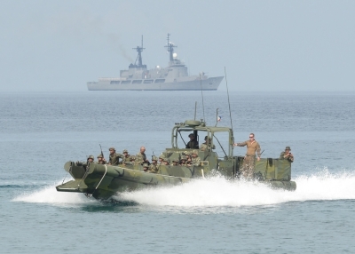 Philippine and U.S. marines ride on a boat as they prepare to land on a beach facing the South China Sea during a beach assault exercises in San Antonio town, Zambales province on May 9, 2014. Scores of U.S. and Filipino marines launched mock assaults on a South China Sea beach in the Philippines on May 9 in war games aimed at honing the allies’ combat skills. (Ted Aljibe/AFP/Getty Images)