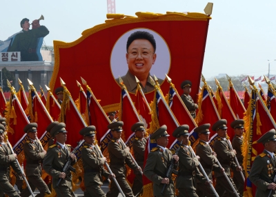 North Korean soldiers carry a portrait of late leader Kim Jong-Il during a military parade to mark 100 years since the birth of the country's founder Kim Il-Sung in Pyongyang on April 15, 2012. (Pedro Ugarte/AFP/Getty Images)      