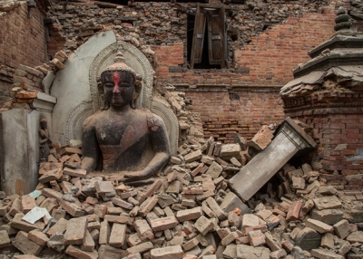 A Buddha statue is surrounded by debris from a collapsed temple in the UNESCO world heritage site of Bhaktapur on April 26, 2015 in Bhaktapur, Nepal. (Omar Havana/Getty Images)