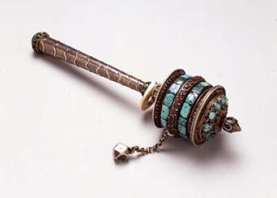 Prayer Wheel. Tibet. 19th century. Silver set with jade, turquoise, rubies, and shell H. 9 1/4 x W. 2 3/8 in. (23.5 x 6 cm). Newark Museum, Gift of Dr. Wesley Halpert and Mrs. Carolyn M. Halpert, 1984, 84.406aâf.Â 