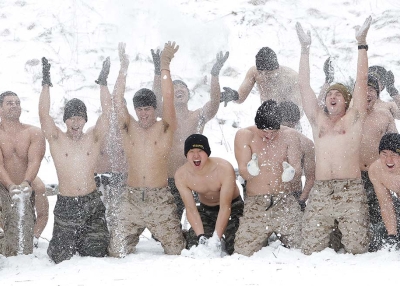 U.S. Marines from 3rd Marine Expeditionary force deployed from Okinawa, Japan, cover themselves in snow with South Korean marines during a winter military training on January 28, 2016 in Pyeongchang, South Korea. (Chung Sung-Jun/Getty)