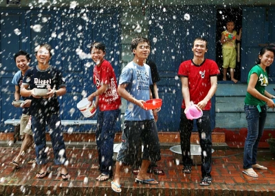 Young people line up to splash water on each other during the Songkran festival on April 13, 2008, in Luang Prabang, Laos. (Chumsak Kanoknan/Getty Images)