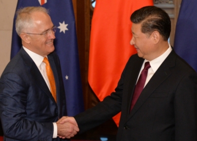 Chinese President Xi Jinping (R) shakes hands with Australian Prime Minister Malcolm Turnbull before their meeting at the Diaoyutai State Guesthouse in Beijing on April 15, 2016. (Kenzaburo Fukuhama/AFP/Getty Images)