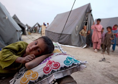 A boy rests at a new camp that opened on Aug. 14, 2010 for flood victims in Sukkur, Pakistan. (Paula Bronstein/Getty Images)