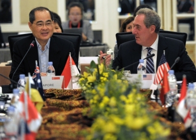 Singapore Minister of Trade and Industry Lim Hng Kiang (L) speaks as US trade representative Michael Froman (R) looks on during the Trans-Pacific Partnership (TPP) Ministerial Meeting in Singapore on May 19, 2014. Trade Ministers and officials from the 12 TPP countries -- Australia, Brunei, Canada, Chile, Japan, Malaysia, Mexico, New Zealand, Peru, the US, Vietnam and Singapore -- convened for the meeting. (Roslan Rahman/AFP/Getty Images)