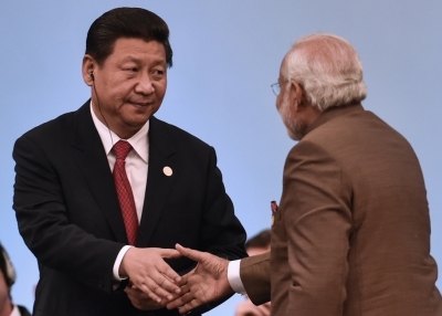 China’s President Xi Jinping (L) shakes hands with India’s Prime Minister Narendra Modi during the 6th BRICS Summit in Fortaleza, Brazil, on July 15, 2014. (Yasuyoshi Chiba/Getty Images)