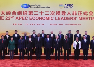 Leaders from Asia-Pacific Economic Cooperation (APEC) economies pose for a group photo at Yanqi Lake, north of Beijing on November 11, 2014. (Greg Baker/Getty Images)