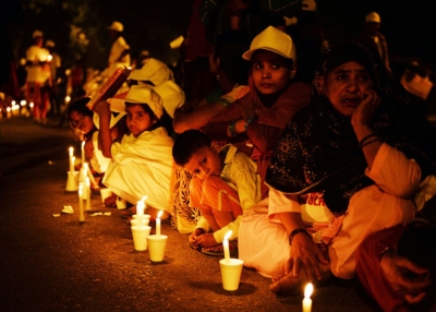 Children are pictured with candles during a protest against child slavery attended by Indian Nobel laureate Kailash Satyarthi in New Delhi on Nov. 22, 2014. (Chandan Khanna/AFP/Getty Images)