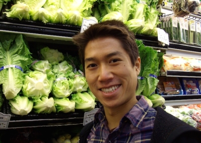 Author Tao Lin poses in front of the produce section at New York City grocery store. (Tao Lin)