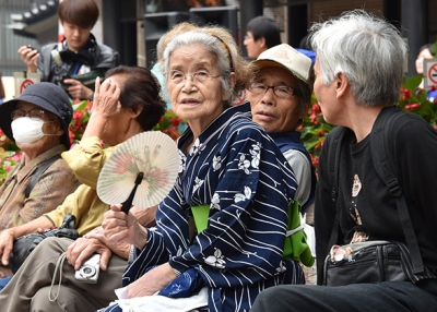 Elderly Tokyo residents rest in a temple on September 15, 2014 as the country marks Respect for the Aged Day. (Yoshikazu Tsuno/AFP/Getty Images)