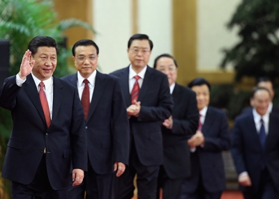 Members of China's incoming Politburo Standing Committee, led by Communist Party General Secretary Xi Jinping, greet the media at the Great Hall of the People on November 15, 2012 in Beijing. (Feng Li/Getty Images)
