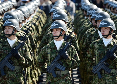 Critics fear that the legislative changes made to Article 9 last November will lead to the swift remilitarization of Japan. (Toru Yamanaka/AFP/Getty Images)
