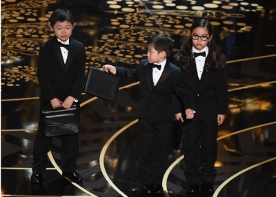 Children represent accountants from PricewaterhouseCoopers on stage at the 88th Oscars on February 28, 2016 in Hollywood, California. (Mark Ralston/AFP/Getty Images)