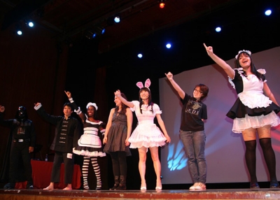 On October 15, 2010, audience members join Japanese singer Reni Mimura onstage for a performance during a cosplay competition at Asia Society in New York. (Elaine Merguerian/Asia Society)