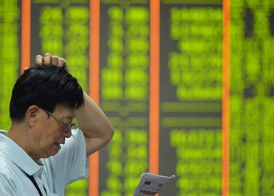 Veteran China-watchers explain what things they look for when monitoring China's economy. (STR/AFP/Getty Images)