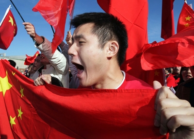 A Chinese supporter shouts at anti-Chinese protestors during the Olympic Torch relay at Parliament House on April 24, 2008 in Canberra, Australia. (Mark Nolan/Getty Images)