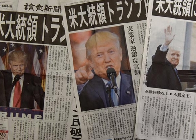 Japanese newspapers report the victory of Donald Trump in the U.S. presidential election in Tokyo on November 9, 2016. (Toru Yananaka/AFP/Getty Images)
