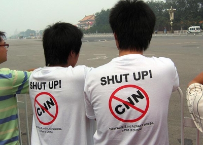 Two Chinese protesters wear anti-CNN t-shirts on Tiananmen Square in Beijing on August 8, 2008. (Robert Saiget/AFP/Getty Images)