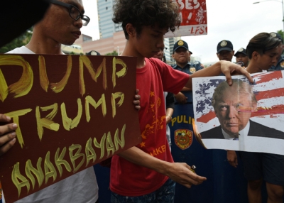 Filipino students burn an mock US flag and photo of US President-elect Donald Trump during a rally in front of the US embassy in Manila on November 10, 2016. (Ted Aljibe/AFP/Getty Images)