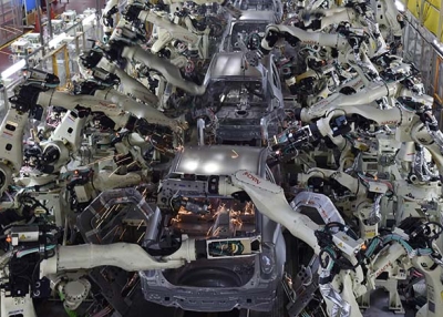Welding machine robots assemble automobile bodies at Toyota Motor's Tsutsumi plant. (Kazuhiro Nogi/AFP/Getty Images)