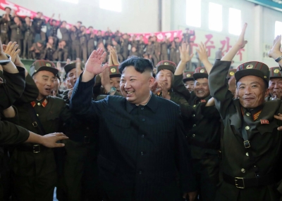  Kim Jong-Un (C) celebrates the successful test-fire of the intercontinental ballistic missile Hwasong-14 at an undisclosed location. (SPR/AFP/Getty Images)