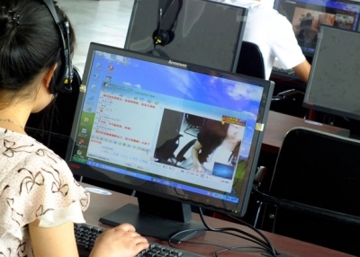 A netizen surfs the web at an Internet cafe in Yichang city, Hubei province. (Yi Chang—Imagine China/Zuma Press)
