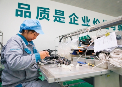 A woman works in a factory in Ganyu, Jiangsu Province, China