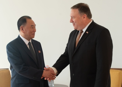 Kim Yong Chol (L) shakes hands with Mike Pompeo