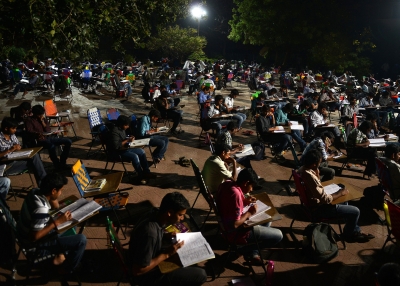 Students study for competitive exams in an open space of the City Central Library in Hyderabad.