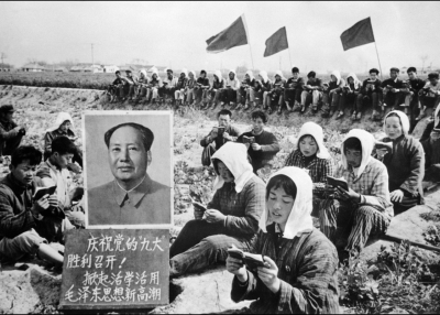 Agricultural workers in China read the Little Red Book beside a portrait of Chairman Mao Zedong during the Cultural Revolution