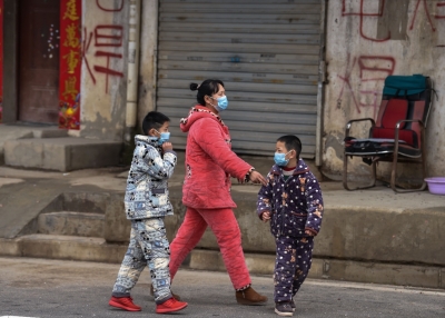 Residents of Wuhan, China wear protective masks to guard against the coronavirus.