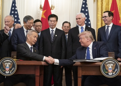 Chinese Vice Premier Liu He and Donald Trump shake hands 