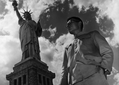 Tseng Kwong Chi. New York, New York 1979 (Statue Of Liberty) From The East Meets West Self-Portrait Series 1979–1989 1979. Hong Kong. Selenium-toned gelatin silver print.H. 20 x W. 16 in. (50.8 x 40.6 cm) Asia Society, New York: Gift of Mitch and Joleen Julis, 2015.15